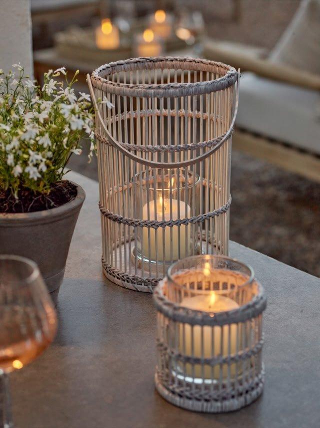 a table with a candle and a glass of wine on it