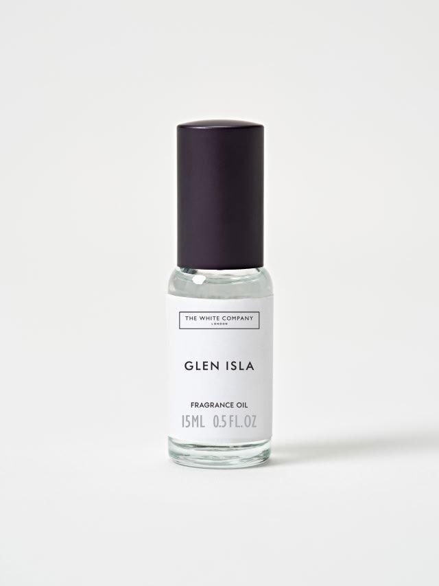 a bottle of glen isla perfume on a white surface