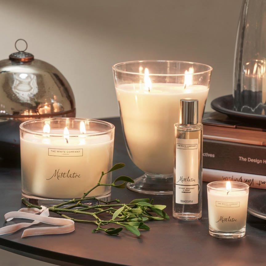 a table with candles and other items on it