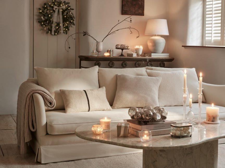 Sofa and table with candles on
