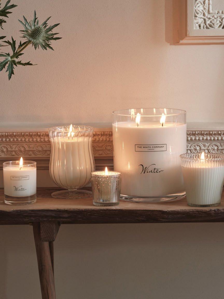 a table with candles and other items on it