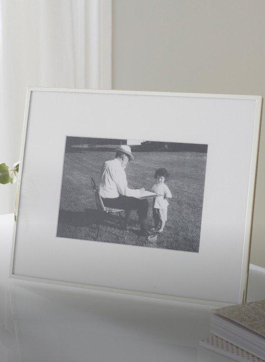 a picture of a picture of a man and a child sitting on a table