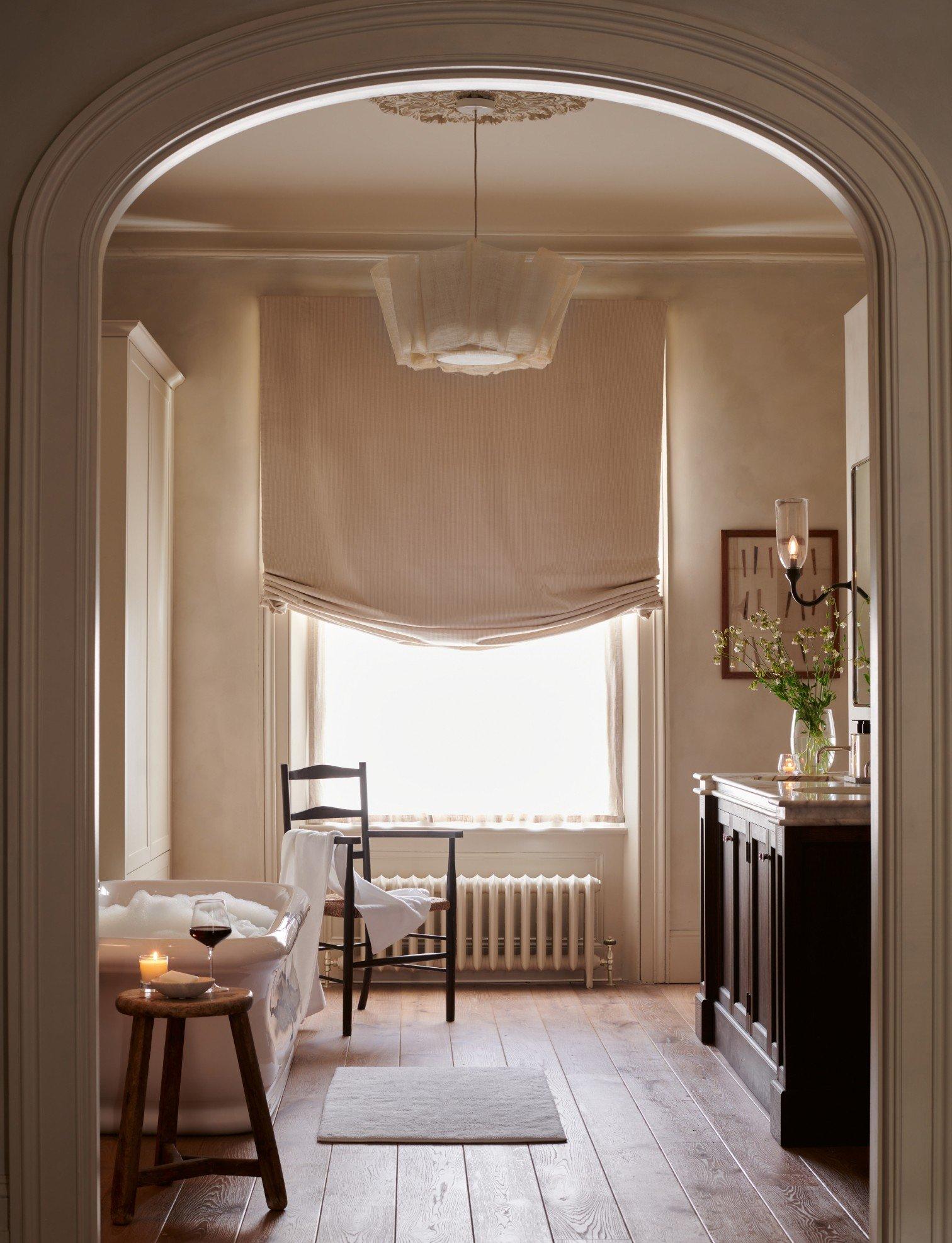 a view of a bathroom with a bathtub and a window
