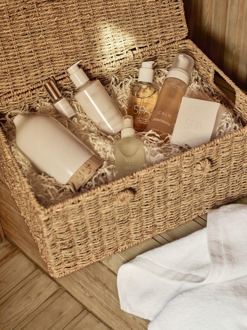 a wicker basket filled with various types of personal care products
