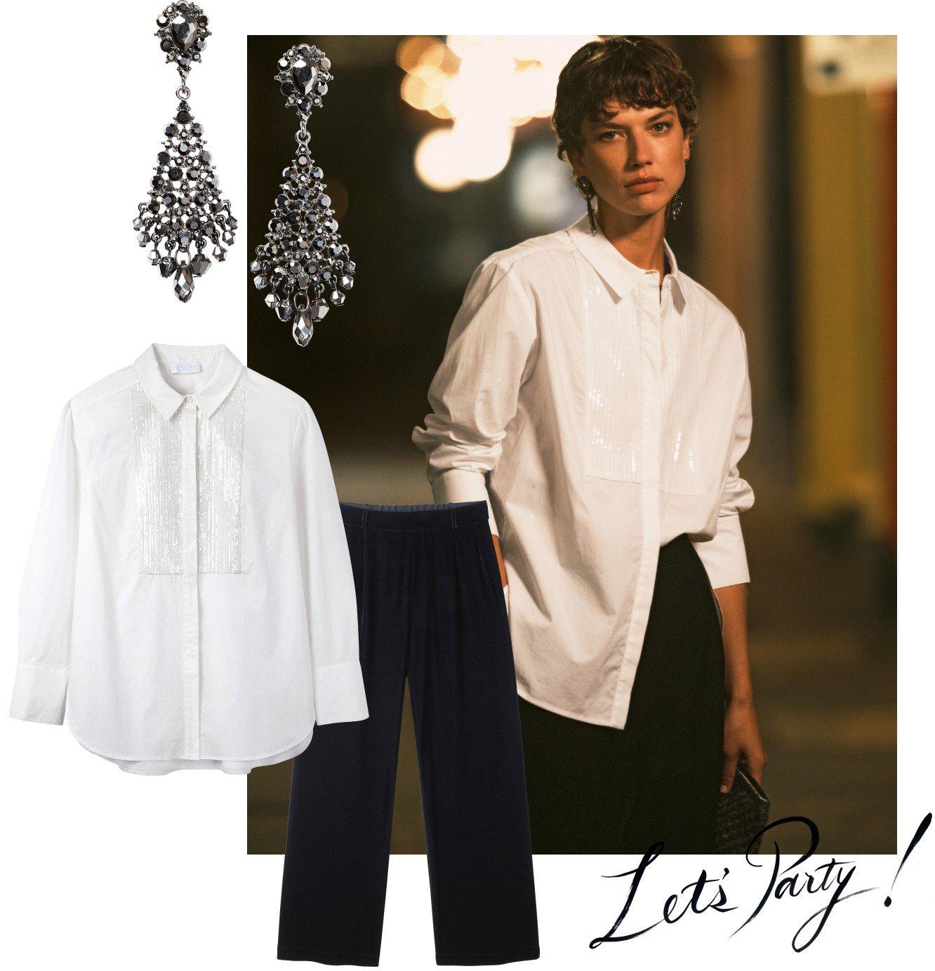 a woman in a white shirt and black pants with earrings