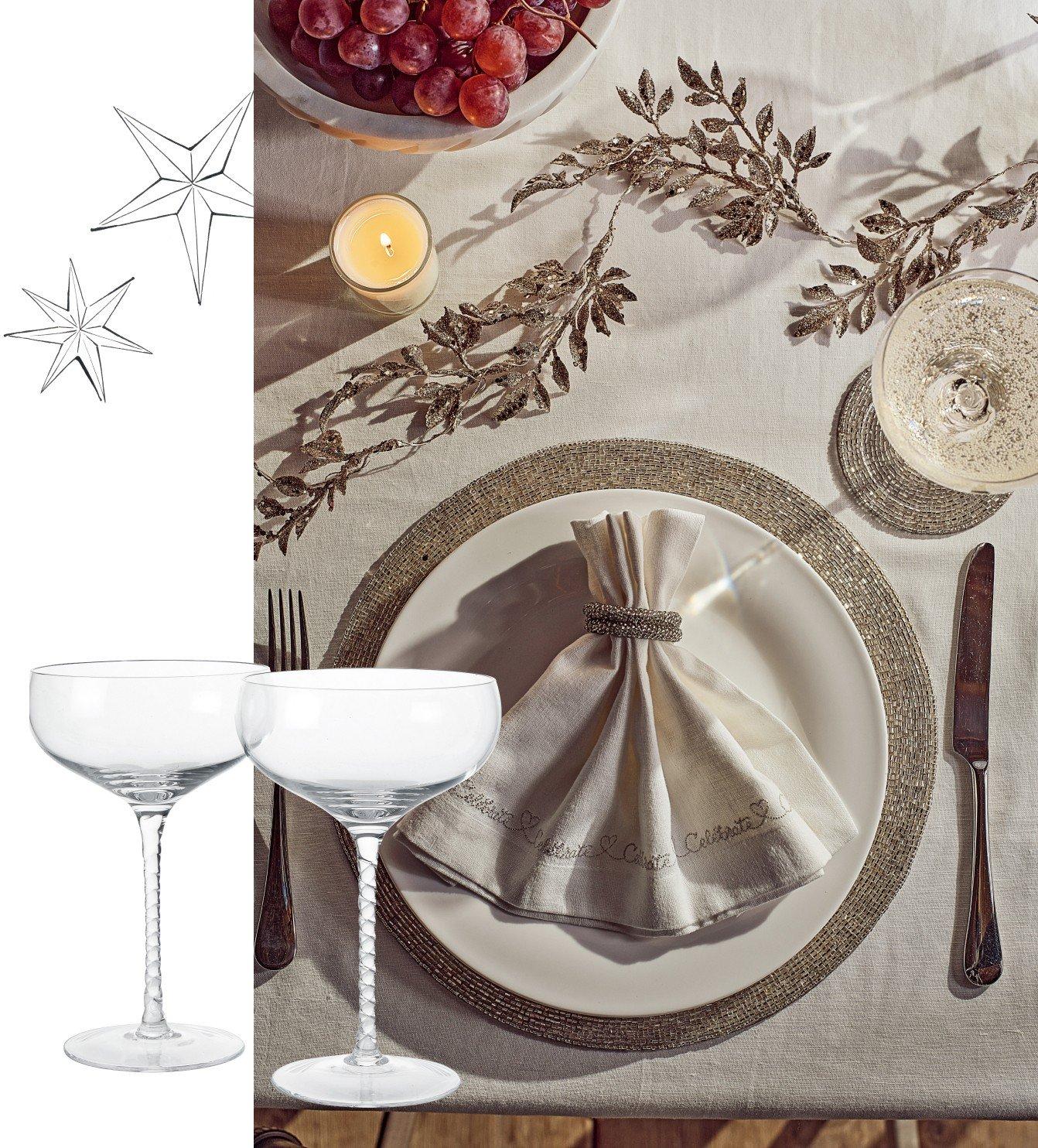 a table setting with a plate of food and a wine glass