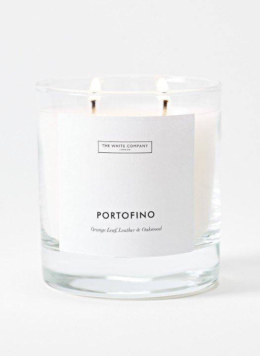 a candle with a label that says portofino