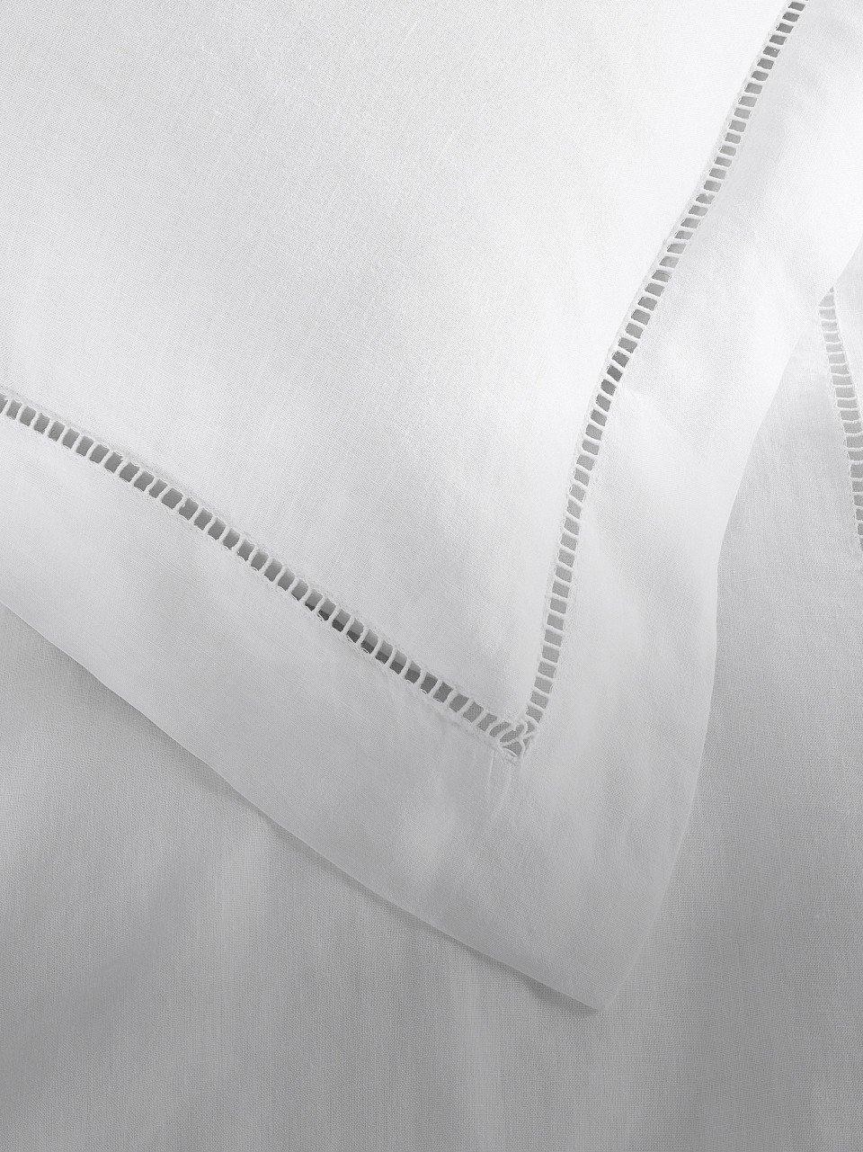 a close up of a white pillow with a white border