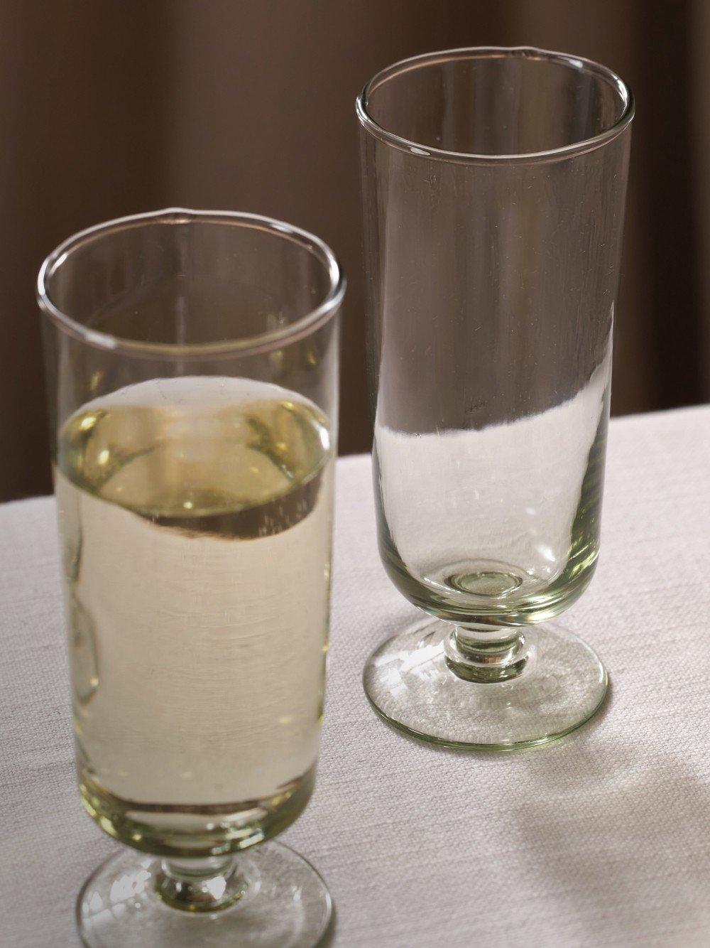 two glasses of wine on a table with a white cloth