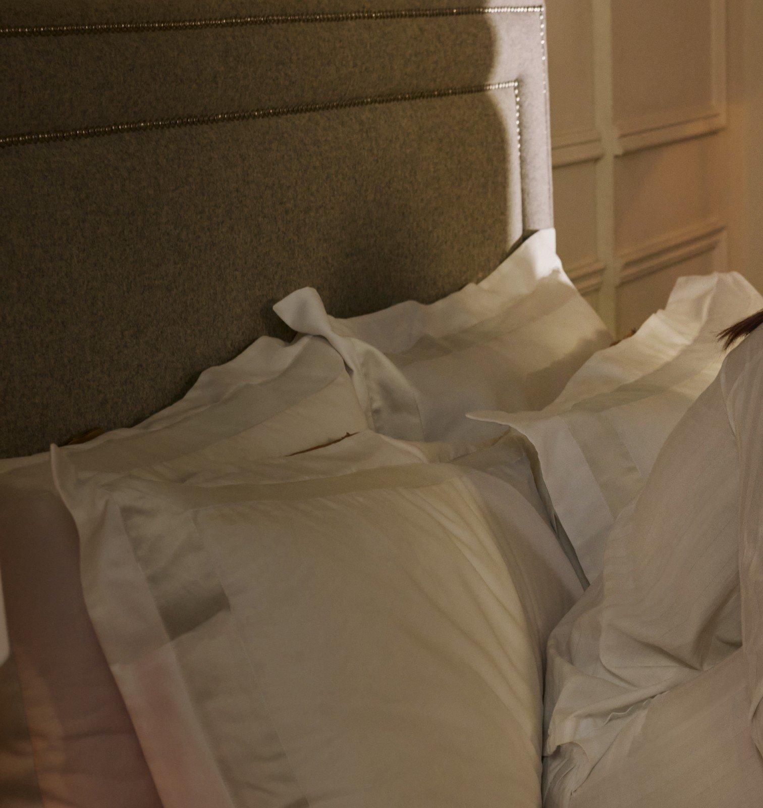 white pillows on a bed