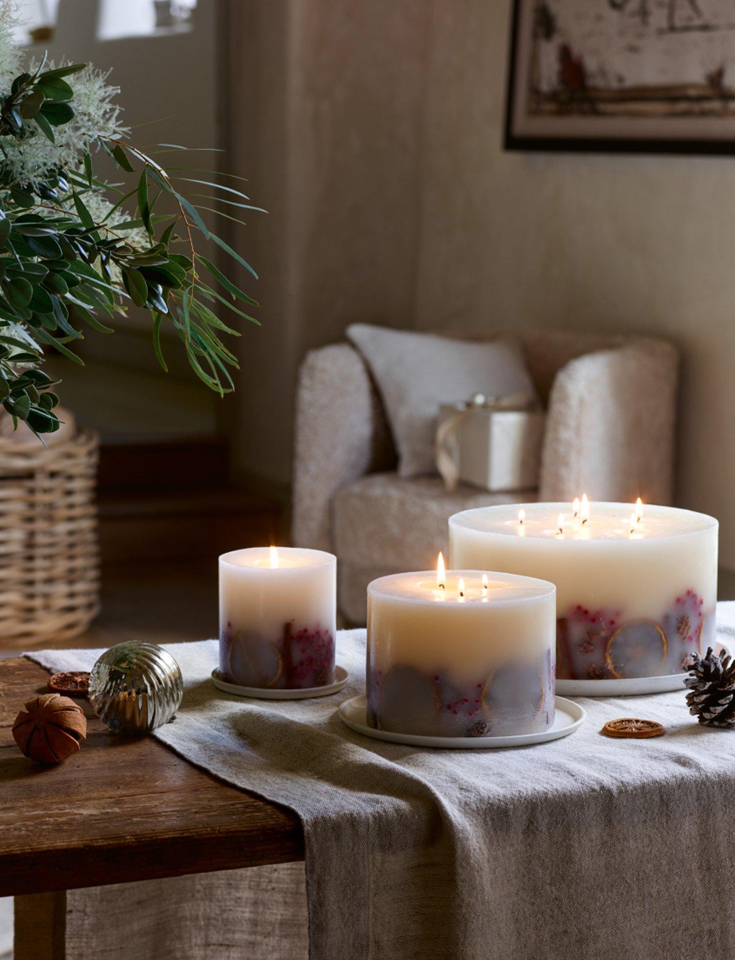 a bedroom with a bed, nightstand, and lamp on a white bed