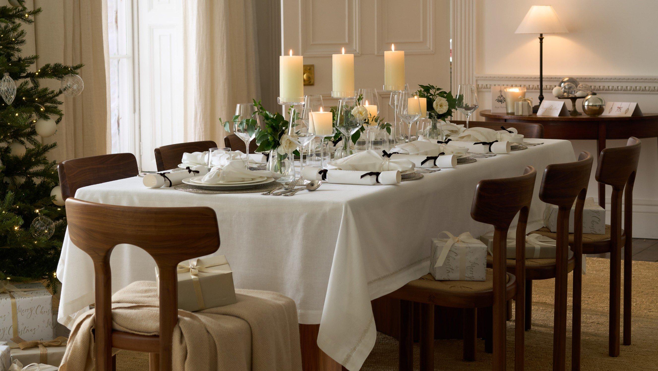 a dining room with a table set for a christmas dinner