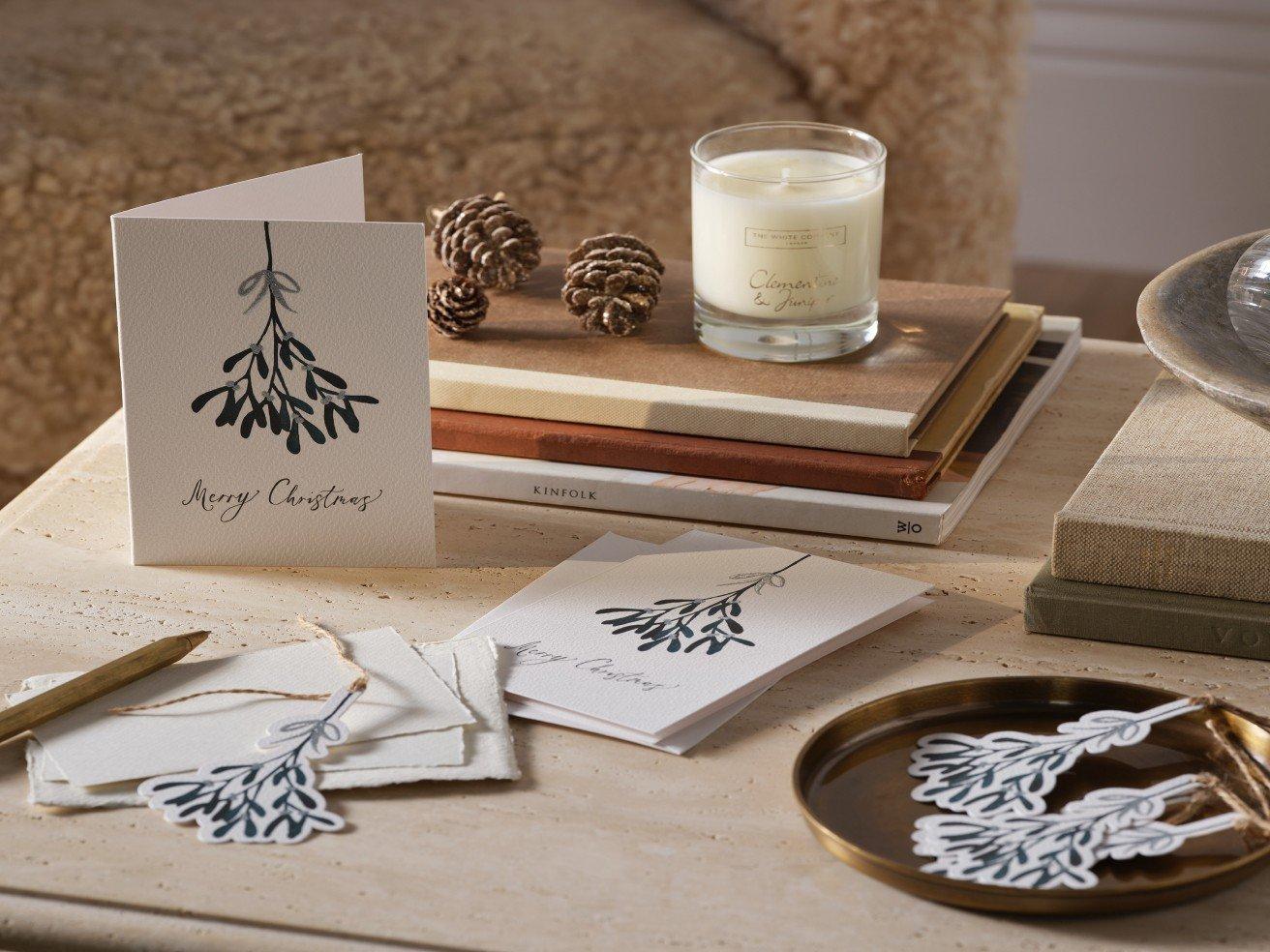 a table with a card and a candle on it