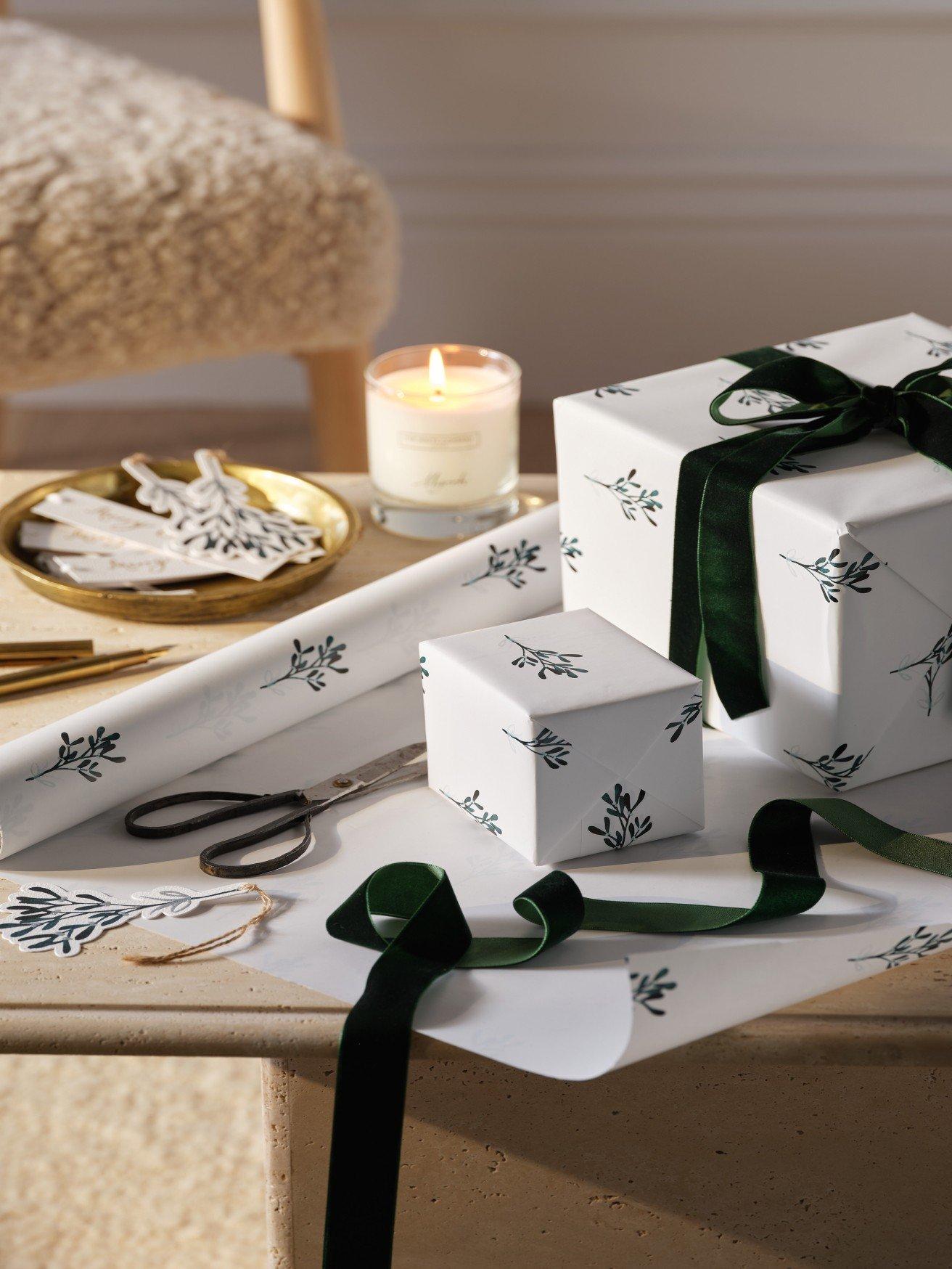 a table with a bunch of presents and scissors on it