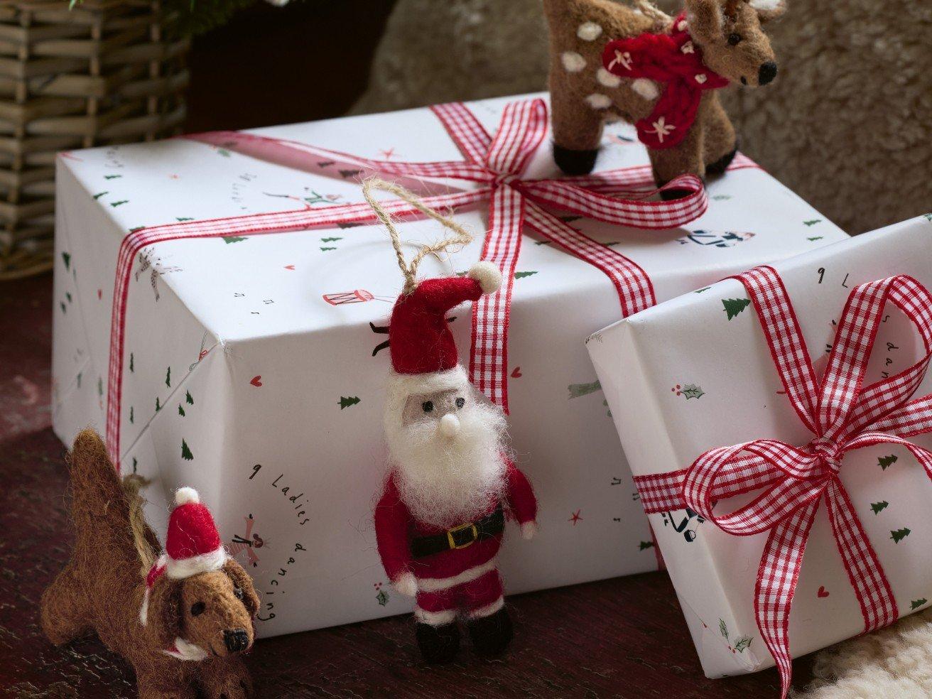 a close up of a christmas present with a santa clause and a reindeer