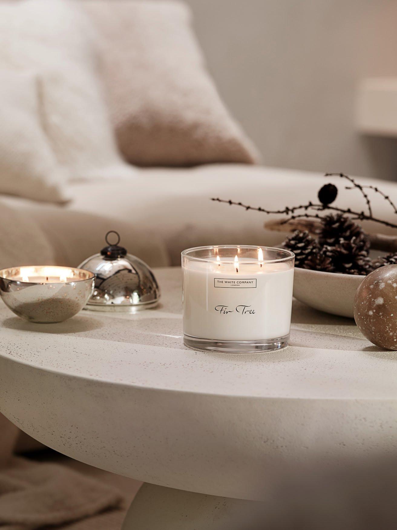 a table with a candle and some other items on it
