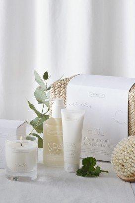 a white bag with a white bottle of perfume and a white bag with a white bottle of perfume
