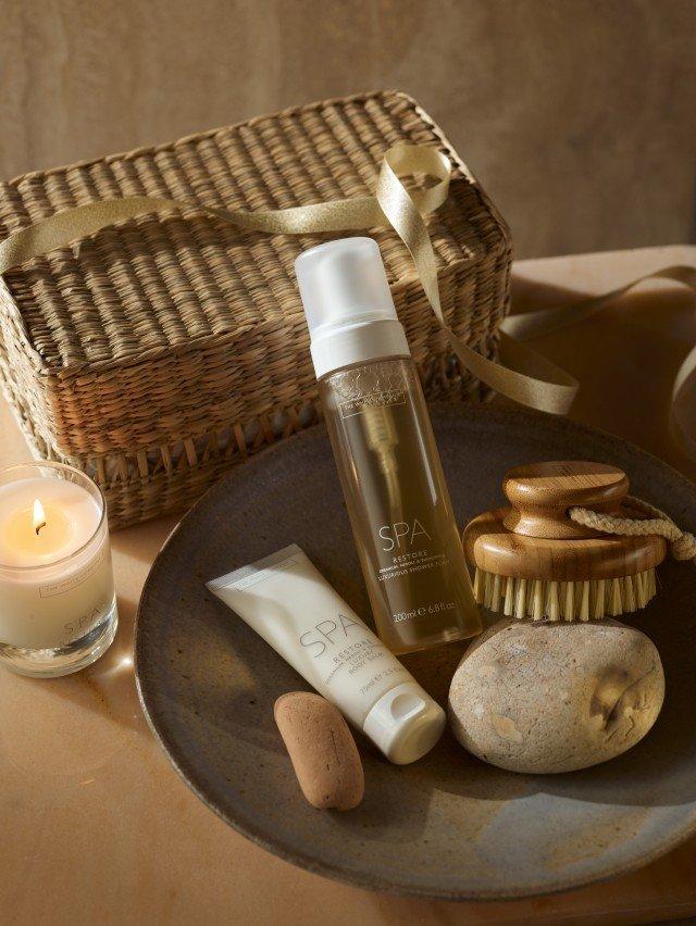 a plate of a basket of items on a table with a candle