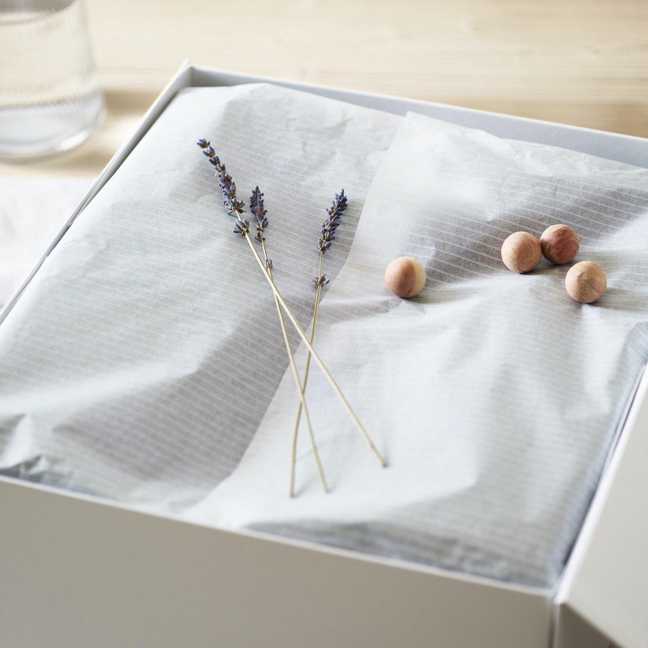 a box with tissue paper lavender and cedar balls