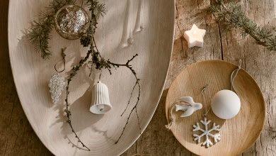 a wooden table with a plate of decorations on it