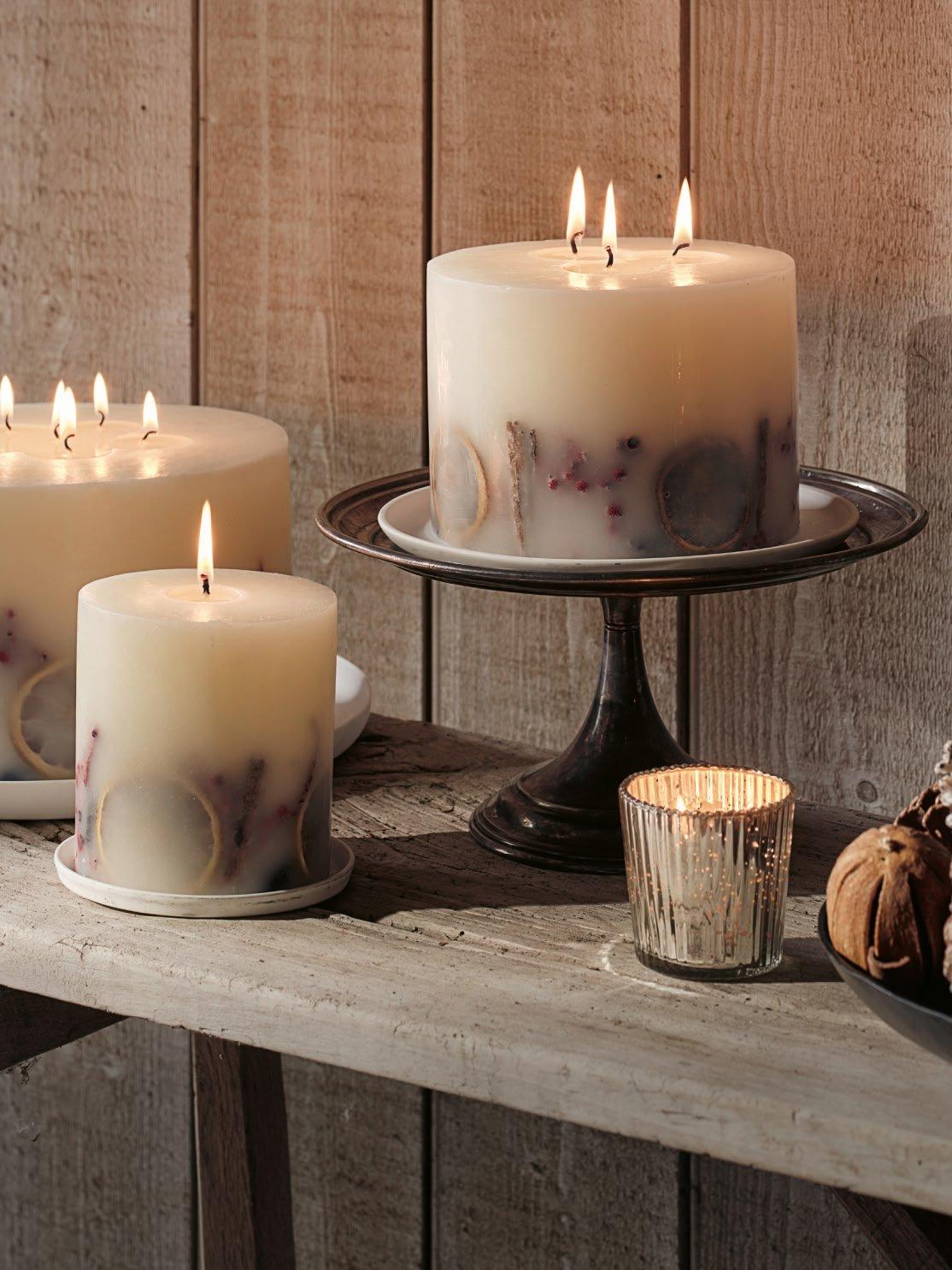 a table with candles and a bowl of nuts on it