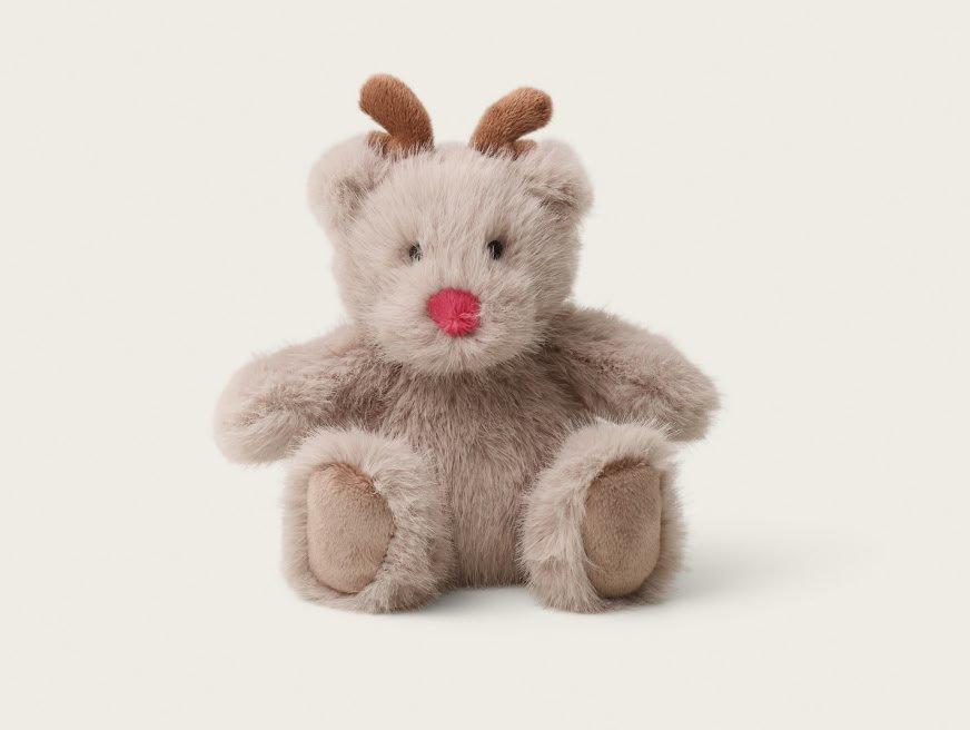 a small stuffed animal with a red nose and a red nose