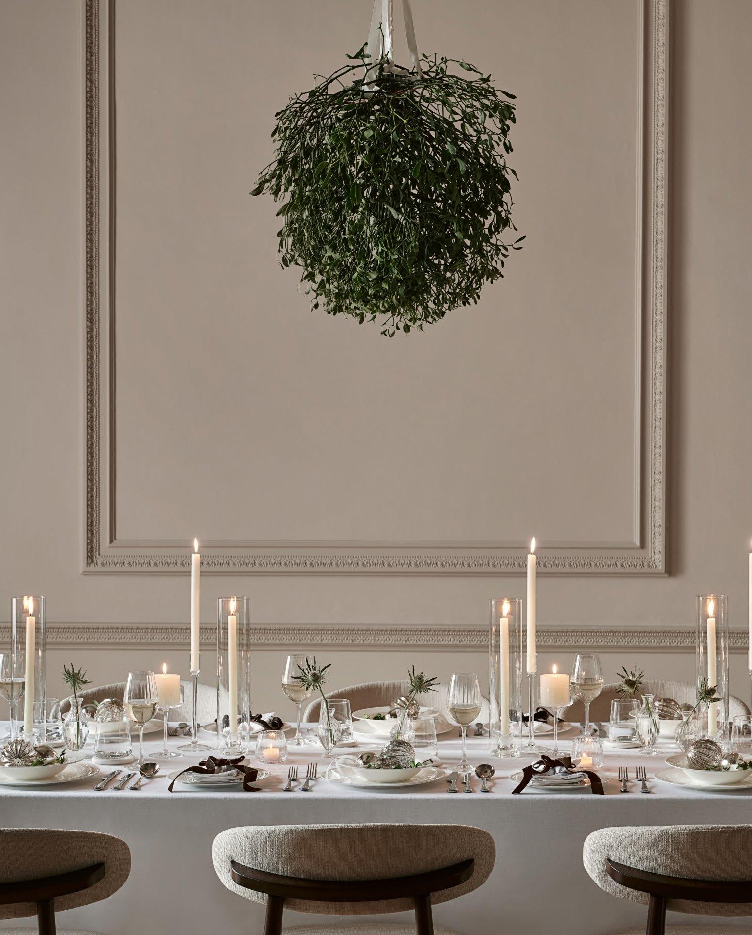 a dining room with a table set for a formal dinner
