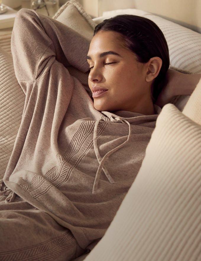 a tablet computer sitting on a rug next to a cup of coffee