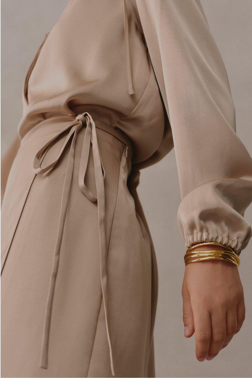 a woman wearing a long dress