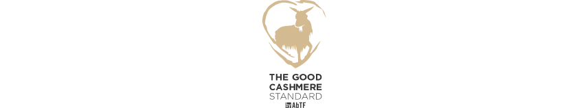 a tall man standing in the dark with a long white object