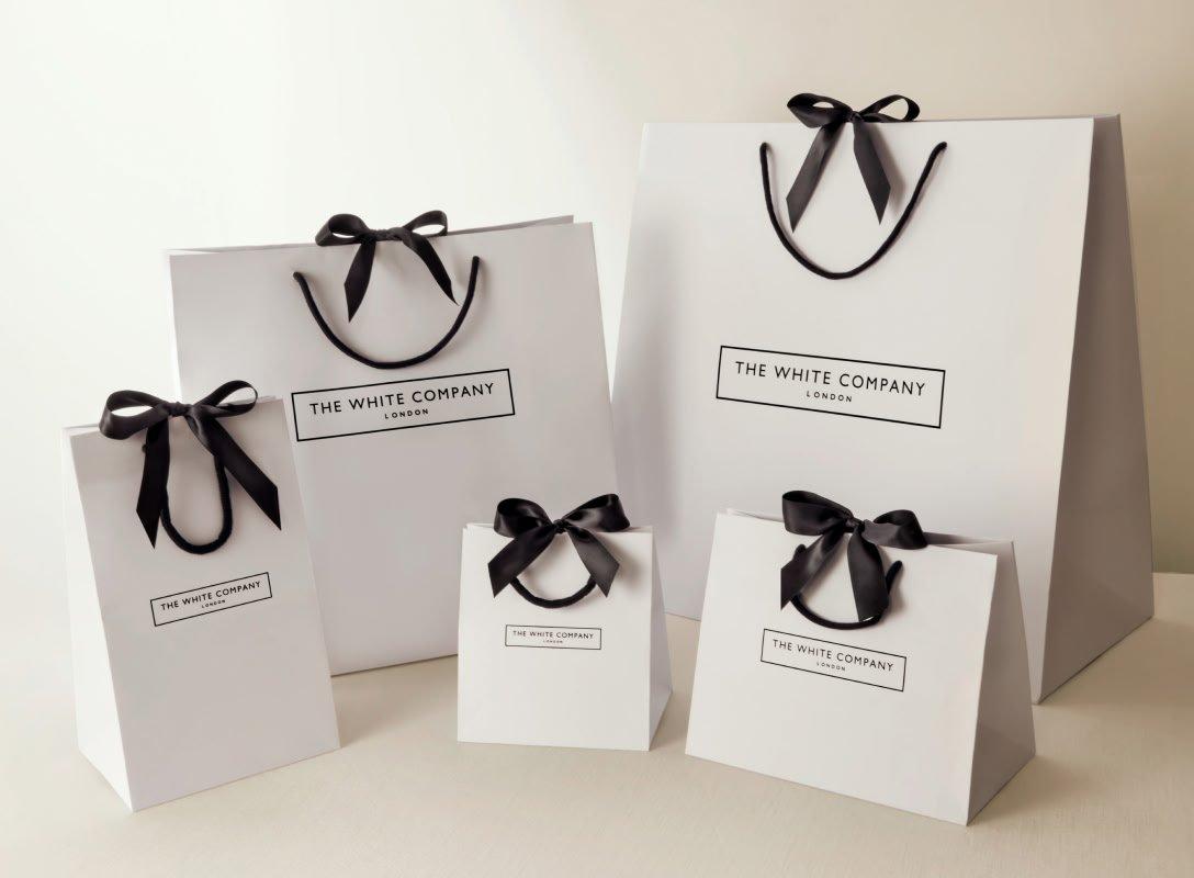 three small bags on them sit on a table