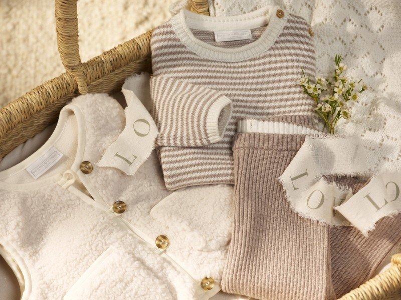 a basket with a tag that says "love" and a sweater