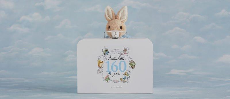 a bunny sitting in a box with a sign that says 160