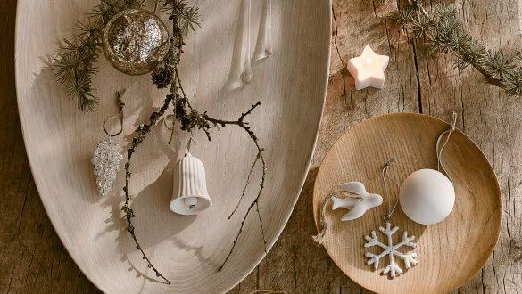 a wooden table with a plate of decorations on it