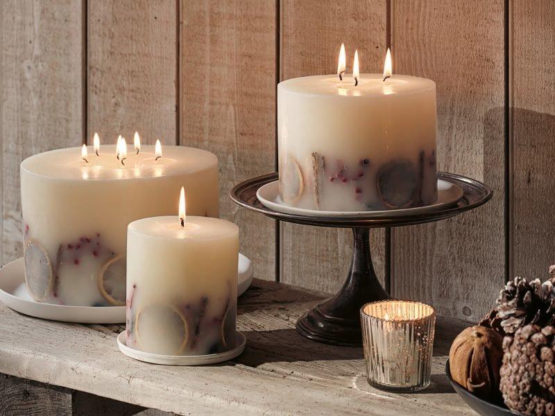 a table with candles and a candle holder on it