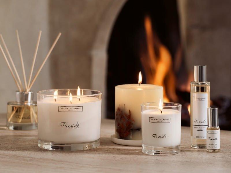 a group of candles and other items sit on a table