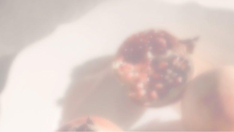 a blurry image of pomegranates
