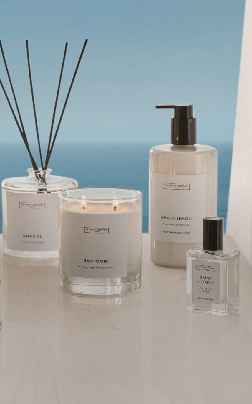 a group of candles and other items are displayed on a table