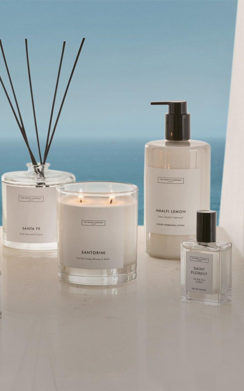 a group of candles and other items are displayed on a table