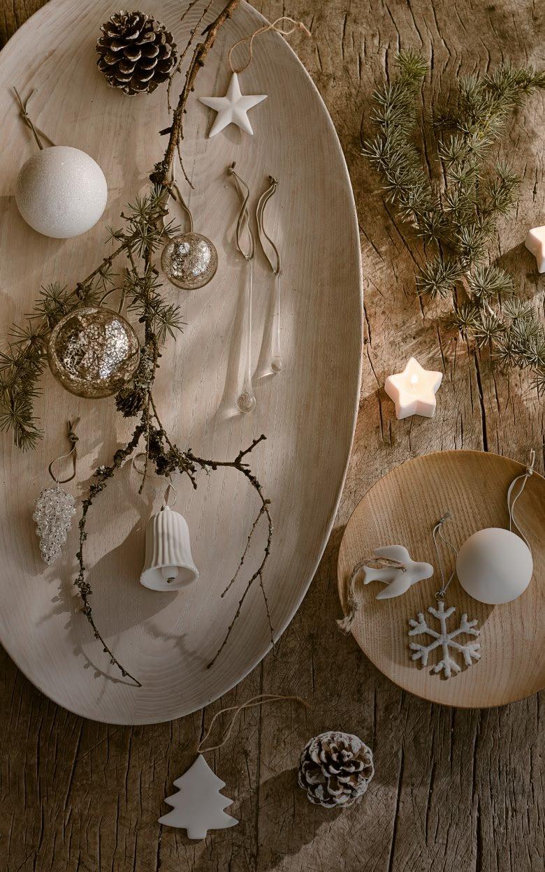 a wooden table with a plate of decorations on it