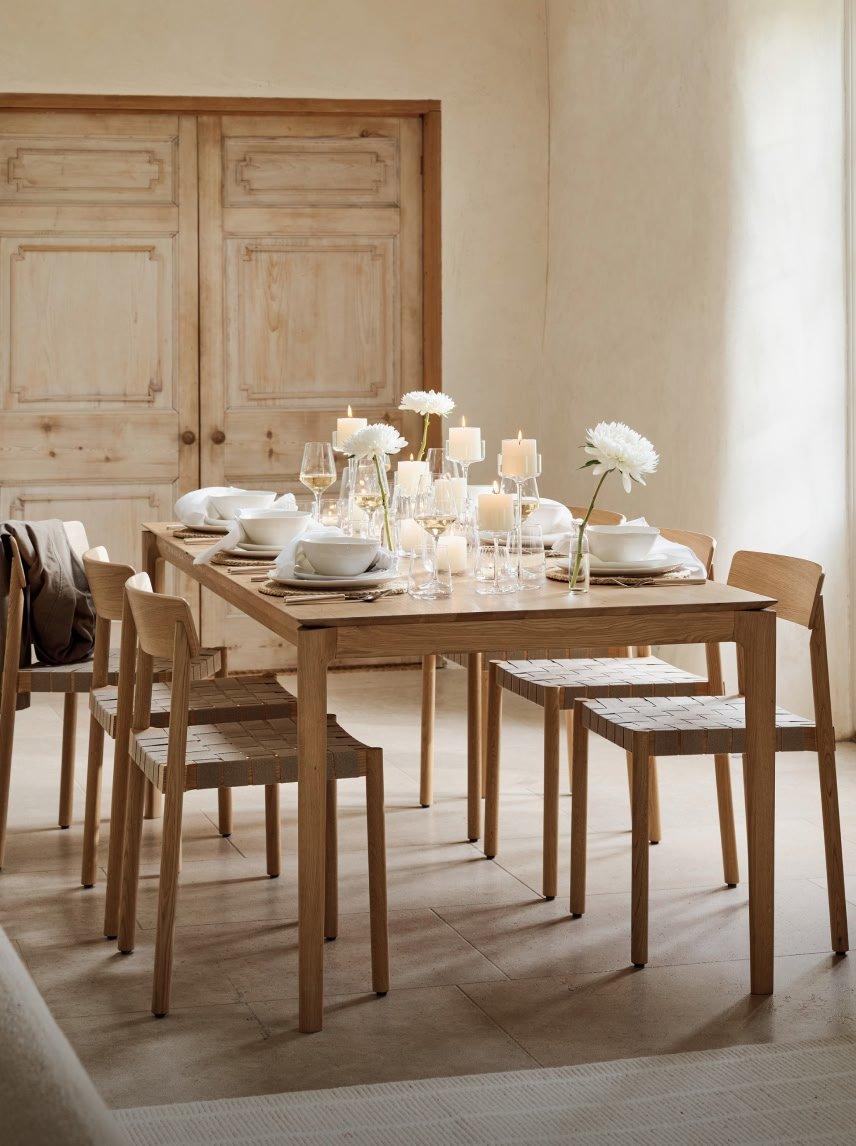 a dining room with a table and chairs and a fireplace