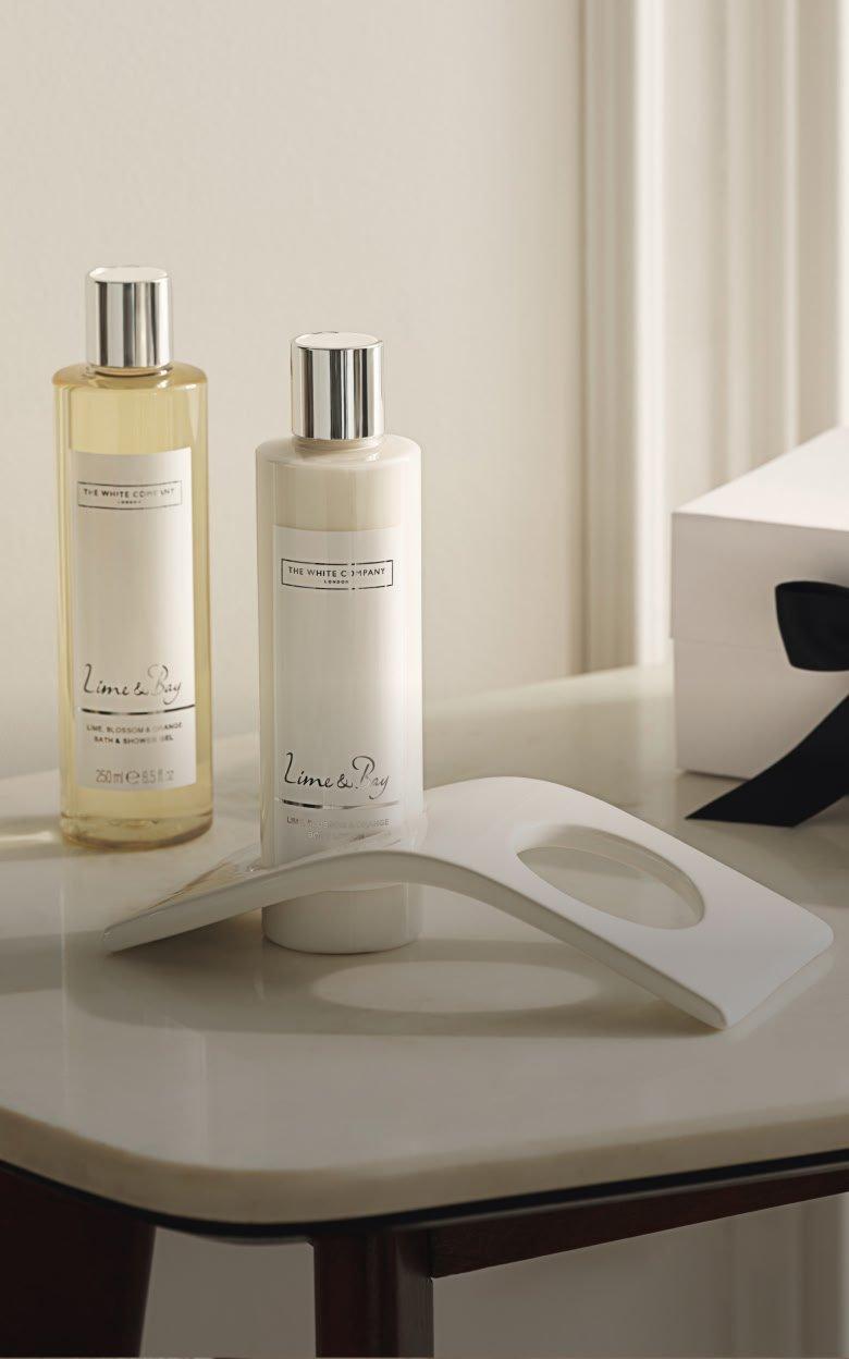 a couple of a couple of bottles of soap sitting on a tray