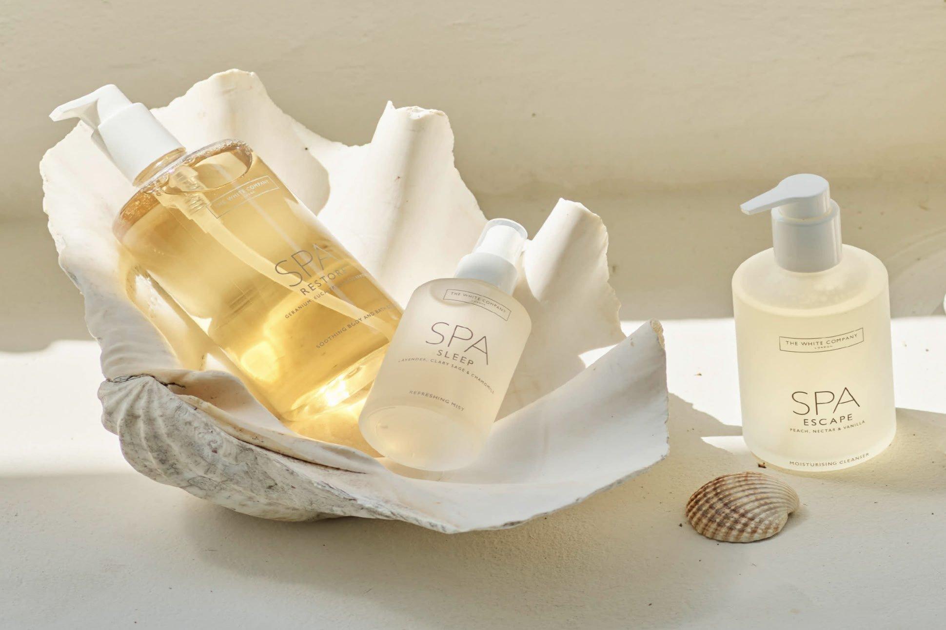 a bottle of body wash and a bottle of body lotion