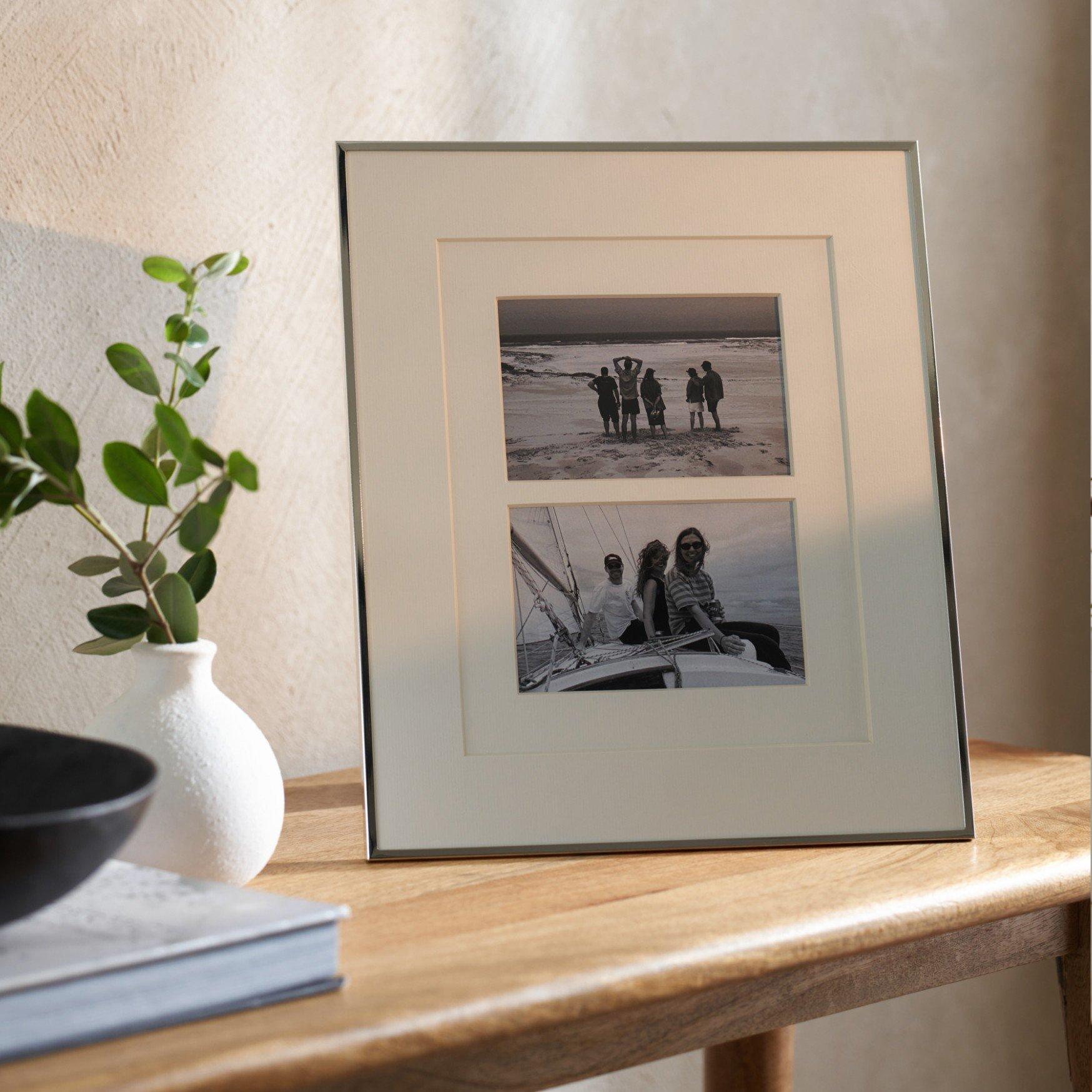 a picture of a picture frame on a table with a vase