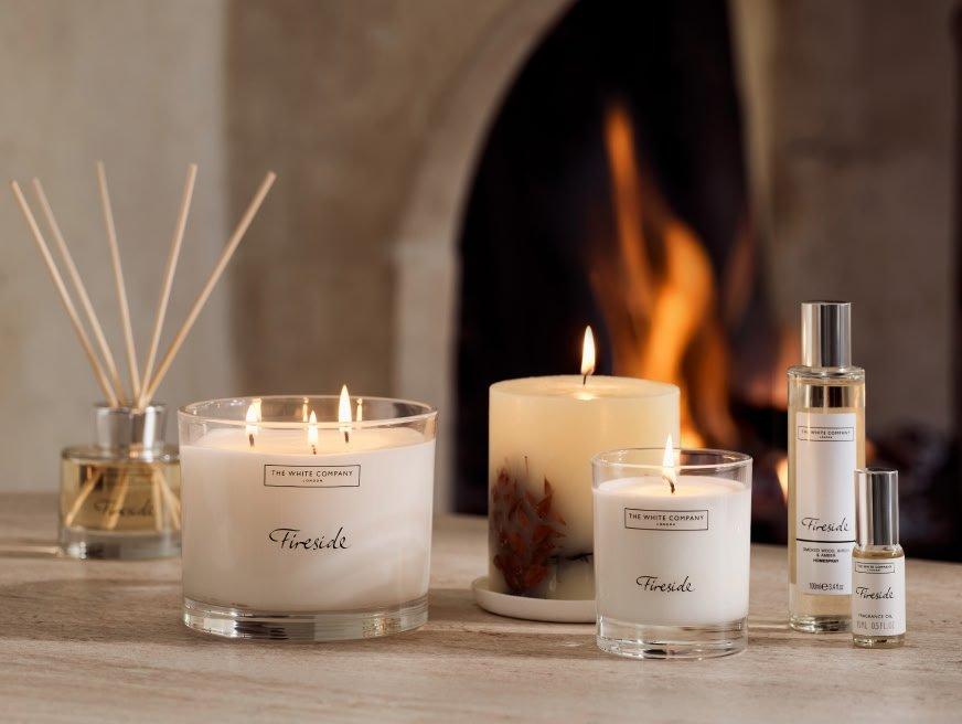 a group of candles and other items sit on a table