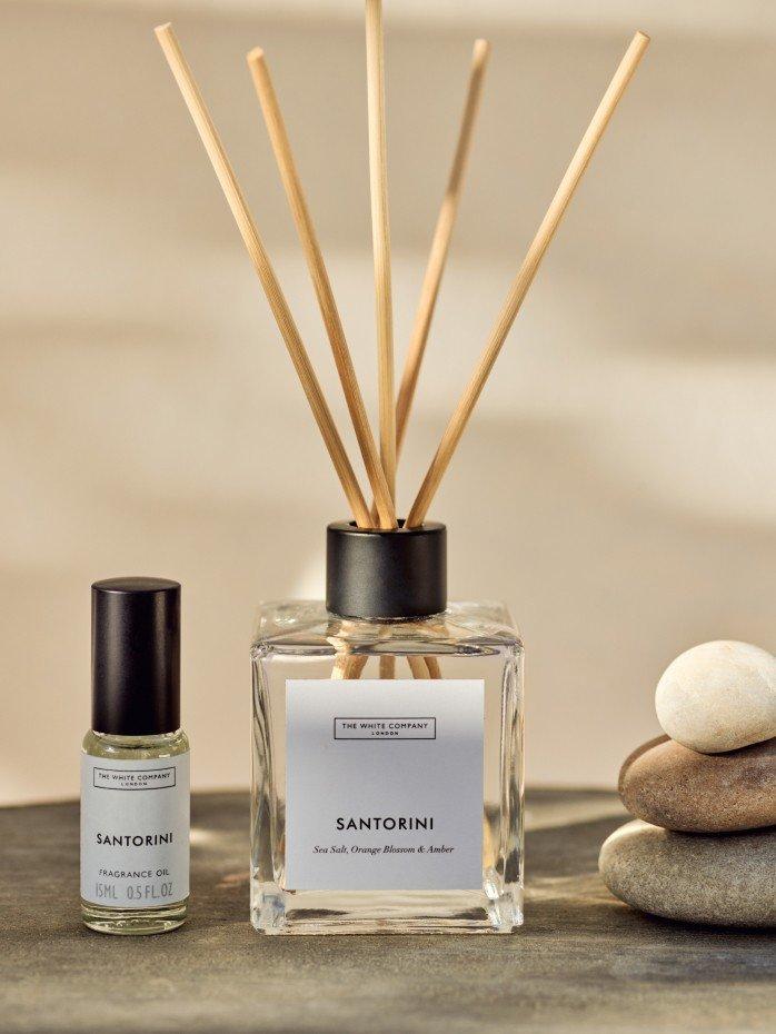 a bottle of reed diffuser and a bottle of essential oil