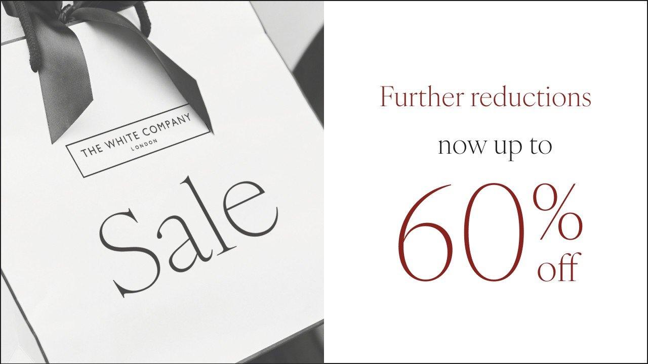 a white box with a black ribbon and a 60 % off sign