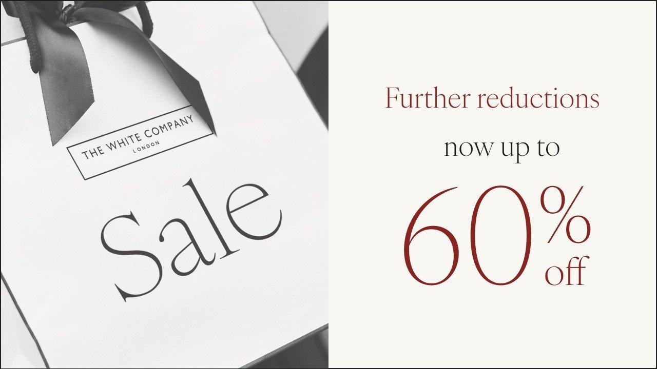 a white box with a black ribbon and a 50 % off sign