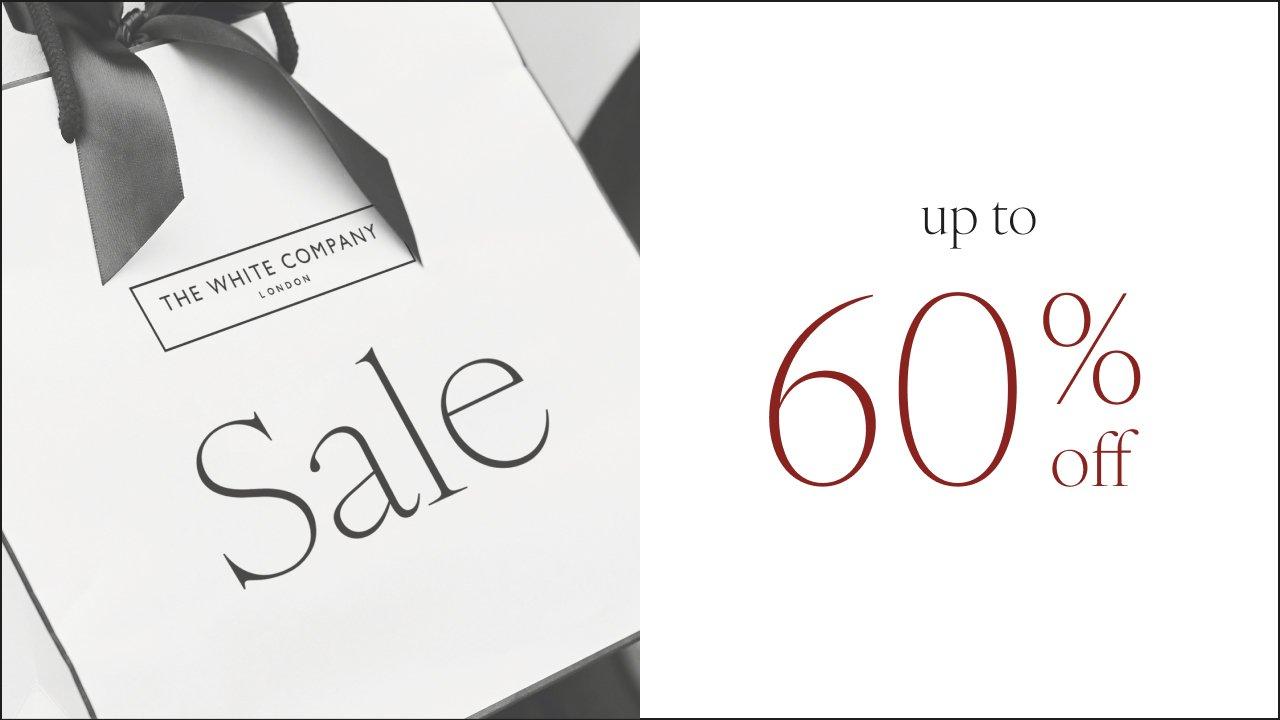 a white box with a black ribbon and a 60 % off sign