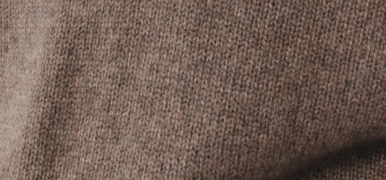 a close up of a brown colored fabric with a white stripe